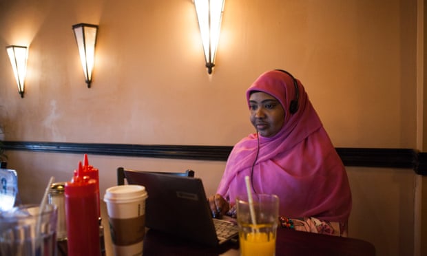 Saciido Shaie works on her laptop at African Paradise, one of the most popular Somali restaurants in the area.
