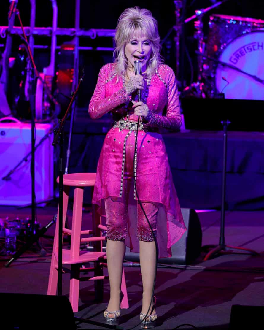 Dolly Parton performs at the 2021 Kiss Breast Cancer Goodbye Concert in Nashville, Tennessee. Her debut thriller is out in March, co-written with James Patterson.