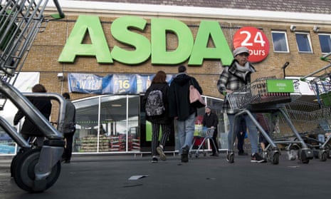 Customers come and go at a branch of Asda