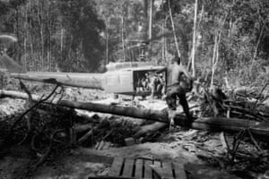 Members of the US 173rd Airborne Division race for a medical evacuation helicopter in War Zone D, Vietnam, 1966