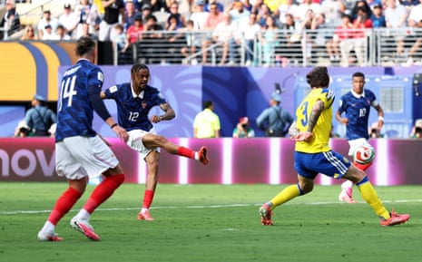 Bradley Barcola shoots and scores France's second goal