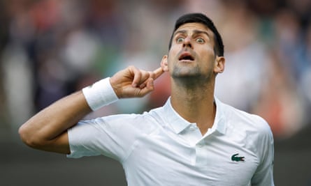 Novak Djokovic sarcastically gestures to the crowd after he beats Jordan Thompson on Centre Court during day three