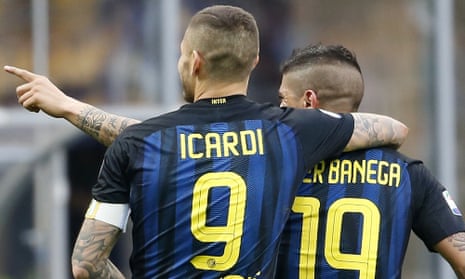 Inter Milan’s Ever Banega, right, celebrates with his teammate Mauro Icardi after scoring for Inter against Atalanta.