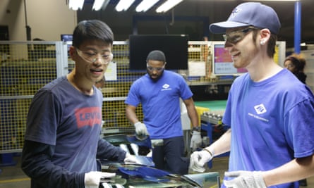 Three factory workers.