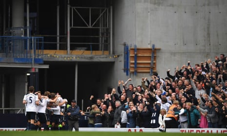 Dele Alli of Tottenham Hotspur celebrates scoring his sides first goal with his Tottenham Hotspur team-mates infront of the joyous Spurs fans.