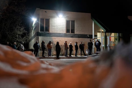 Voters line up for the polls to open to cast their ballots in the New Hampshire Republican presidential primary in Manchester, New Hampshire.