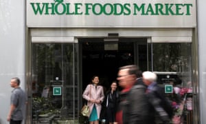 People exit a Whole Foods Market in New York.