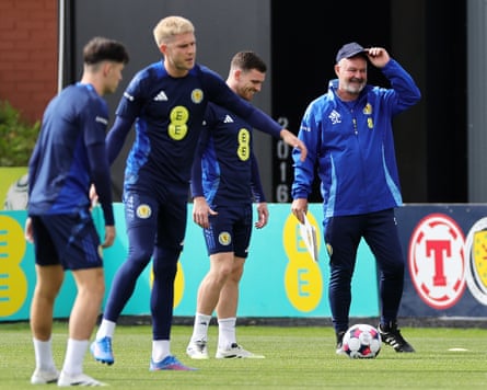 Steve Clarke (right) astatine Scotland training