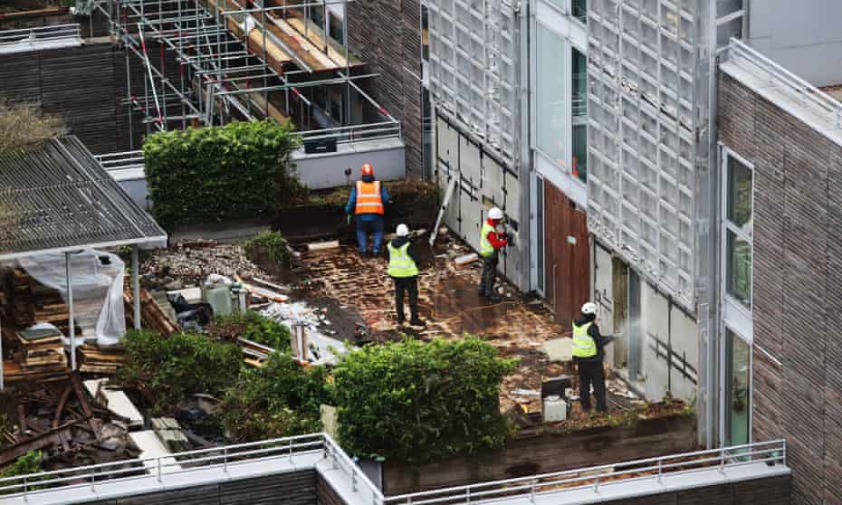 Contractors undertake work at a residential property in London as part of a project to remove and replace non-compliant cladding. Around 274,000 flats still have dangerous cladding, according to the Association of Residential Managing Agents.