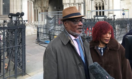 Winston Trew with his wife, Hyacinth, outside of the Royal Courts of Justice