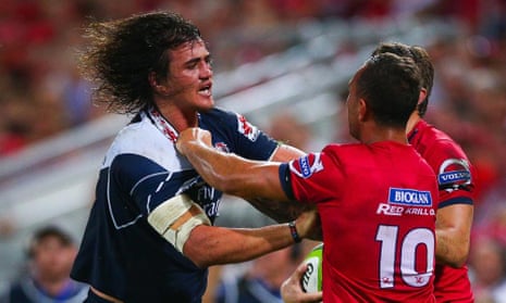 Quade Cooper and Franco Mostert square up during the Lions’ victory over the Reds.