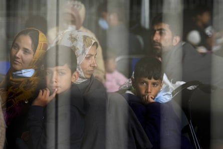 Evacuees from Afghanistan wait with other evacuees to fly to the US or another safe location in a makeshift departure gate inside a hanger at the US Air Base in Ramstein, Germany, on 1 September 2021.
