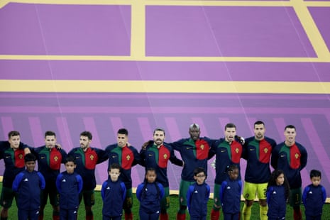 The Portugal players line up during the national anthems.