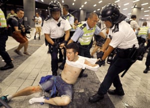 Riot police clash with protesters in Hong Kong in the early hours of Monday morning.