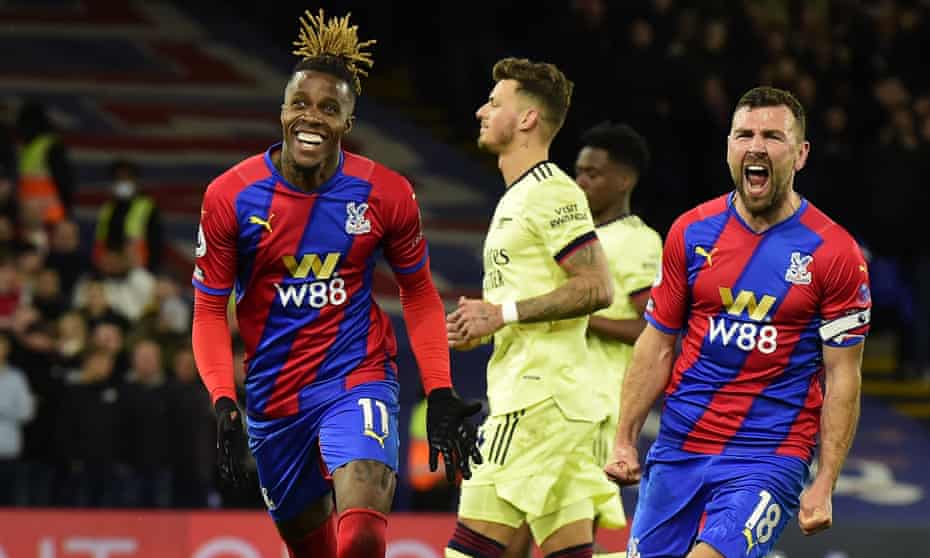 Wilfried Zaha (left) celebrates after scoring Crystal Palace’s third goal.