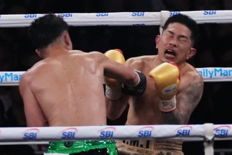 Takuma Inoue (left) lands a punch during the fifth round.