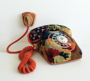 A rotary telephone by Swedish designer Ulla-Stina Wikander, who covers 1970s household objects in second-hand cross-stitches