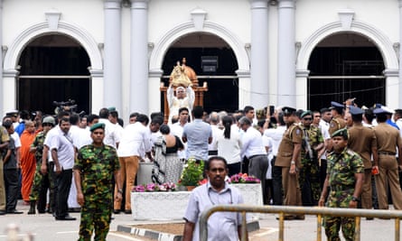 A Sri Lankan priest holds up a statue in front of St Anthony’s Shrine in Colombo