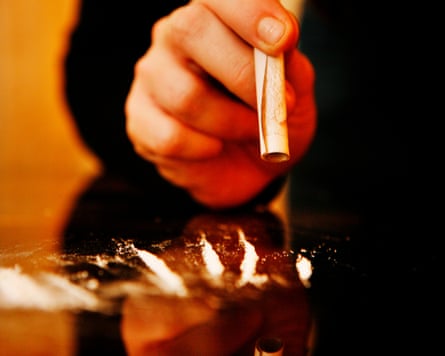 Cocaine being snorted off a table
