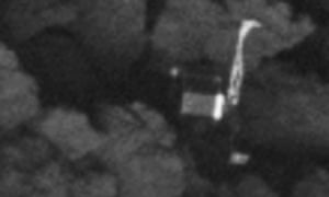 The Philae comet lander lying on its side.