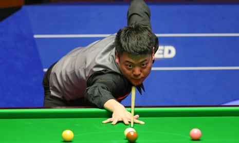 China’s Liang Wenbo lines up a shot at the 2021 World Snooker Championship