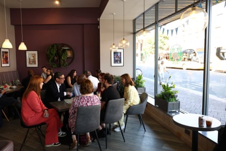 Burnham and Rayner speaking to local business owners and guests in The Hub cafe in Ilkeston.