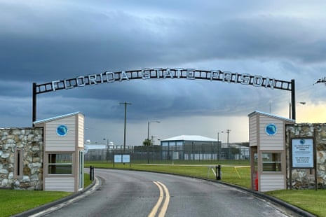 Storm clouds loom over the entrance arch of Florida State Prison in Starke