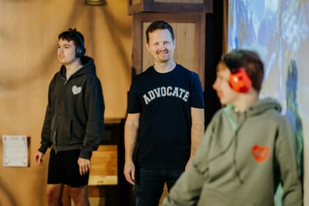 James Hunt with his sons, Jude and Tommy, who are both wearing headphones.