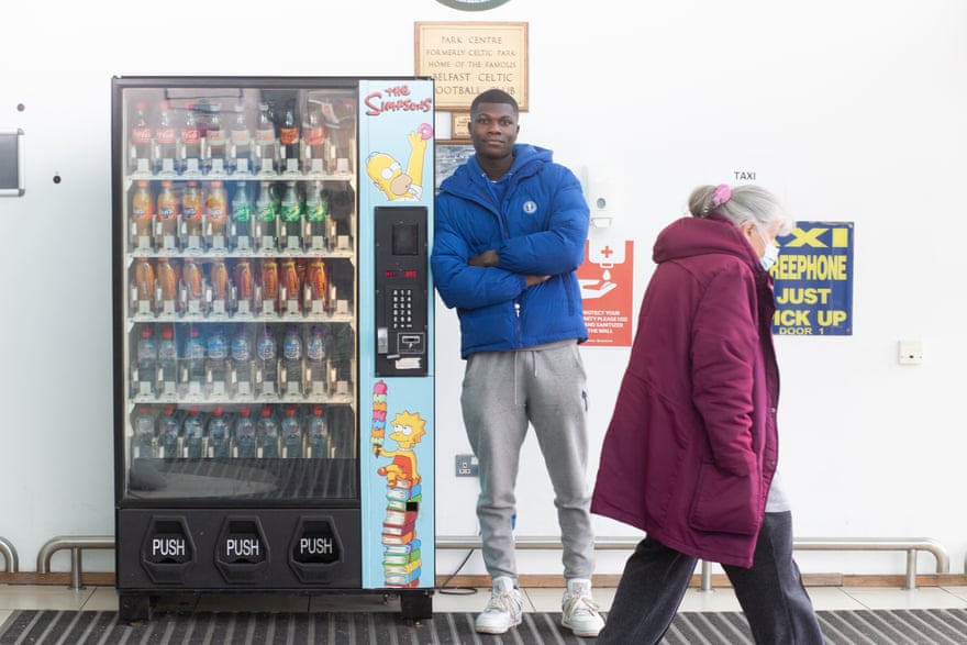 Emmet Oppong with one of his vending machines in west Belfast.