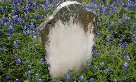 Gravestone surrounded by bluebells
