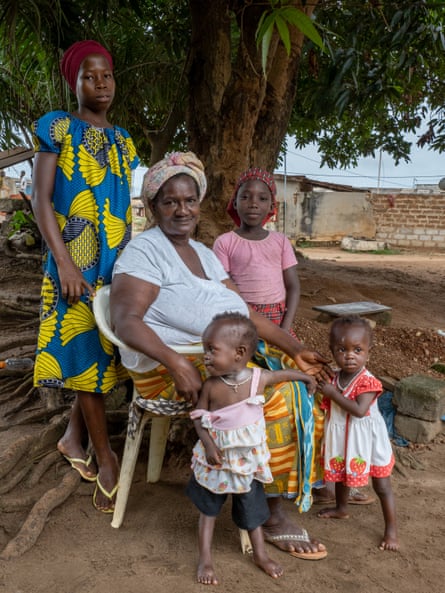 Kouassi Akissi Jeanne with her family at their Ivory Coast village.