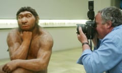 A photographer takes pictures of a reconstruction of a neanderthal man at the State Museum of Prehistory in Halle, Germany, in 2004