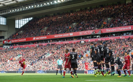 Liverpool’s James Milner hits a free kick over wall and over the bar.