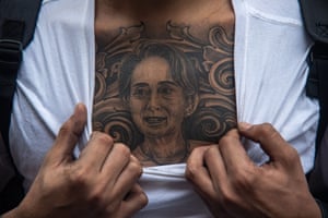 Bangkok, Thailand. A protester reveals a tattoo of Aung San Suu Kyi on his chest during a demonstration by Burmese people outside the Myanmar embassy to mark two years since the military coup