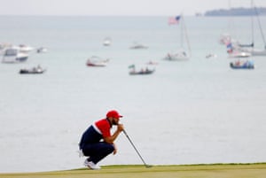 Team USA’s Dustin Johnson lines up his putt on the 8th green.