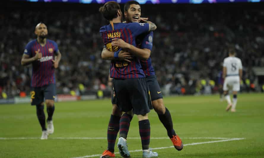 Lionel Messi hugs Luis Suárez after scoring his second and Barcelona’s fourth goal against Tottenham at Wembley.