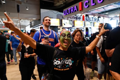 A fan poses for a photo at the Frost Bank Center in San Antonio, Texas.