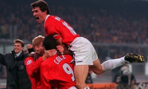 Andy Cole celebrates his goal with Manchester United teammates.