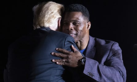 Trump hugs Georgia Senate candidate Herschel Walker.