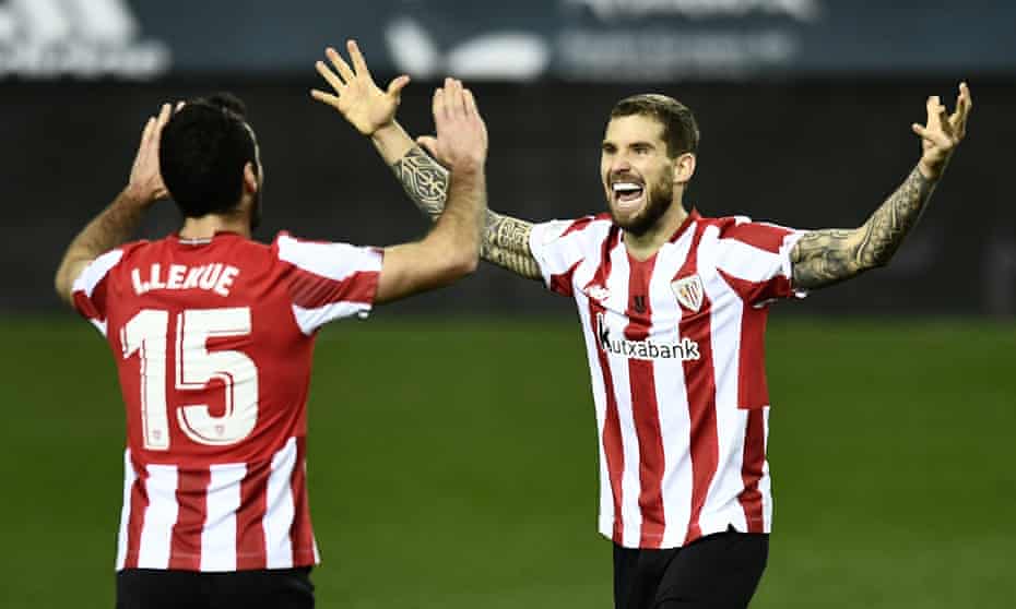 Athletic Bilbao’s Iñigo Martinez and Iñigo Lekue celebrate at the final whistle.