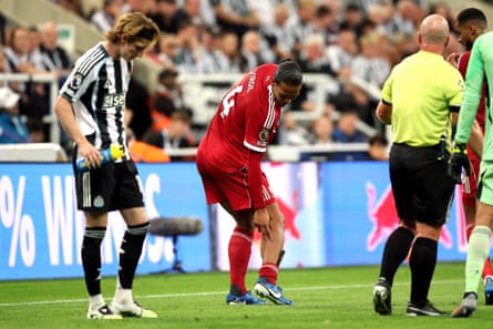Virgil van Dijk shows the injury on his right calf after the tackle by Anthony Gordon that earned the Newcastle striker a red card.