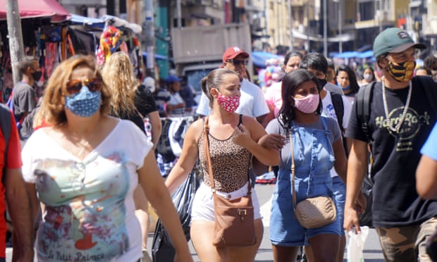 People walk through streets in São Paulo. The state is experiencing high numbers of new infections.