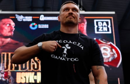 Oleksandr Usyk poses at the weigh-in before his fight against Daniel Dubois.