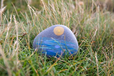 A painted stone found near the beach.