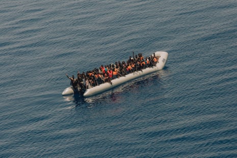 Refugees from African countries aboard a small boat in distress in the Mediterranean Sea in 2017.