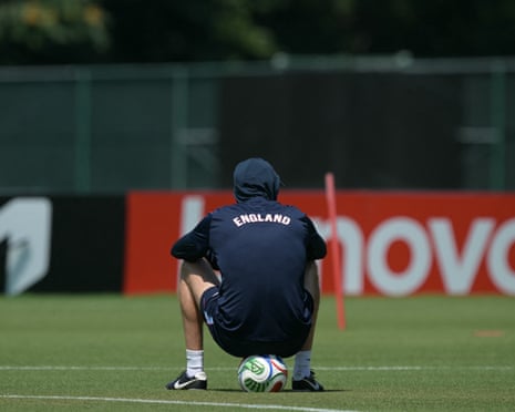 Thomas Tuchel takes a seat in the heat.