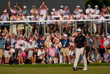 Aaron Rai sends the crowd wild with his birdie on the 17th.