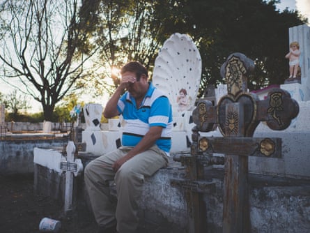 Mexico; Guerrero; Iguala; 2018 Mr Rogelio by his wife and his son’s graves. His son disappeared in 2012 and was found dead the year after. His girlfriend had connections with the local drug cartel and was probably the one who had him killed after he refused to pay a money extortion. Like many other people, Mr. Rogelio had to personally search for his son.