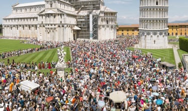 Tourists flood toward the Tower of Pisa