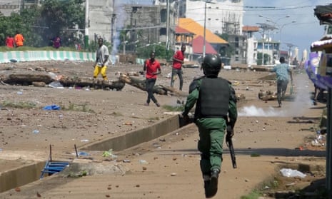 Supporters of opposition leader Cellou Dalein Diallo clash with security forces after election results in Conakry.